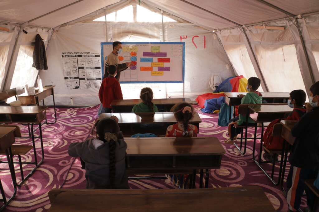 Build classrooms and teach kids in Syrian camps