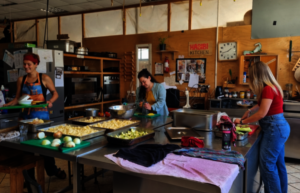 New team members preparing community dinner