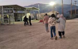 small snapshot: a family walking back to the camp