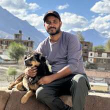 Relaxing with a dog on the Kaza spay/neuter camp