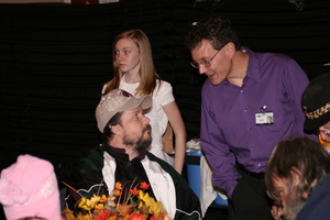 Mission staff engages a guest with holiday cheer