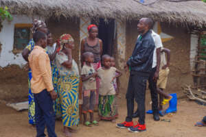FOPAC lead Jean Marie consults with residents