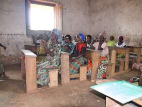 "Bahat" (3d row, front) loves our literacy class.