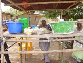 "Gen" sells yellow eggplant and tiny ndagal fish.