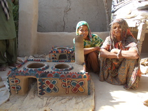 Mrs. Shanti using new constructed cooking stove