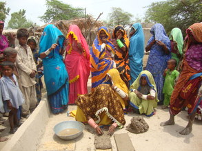 women making bricks for stove making