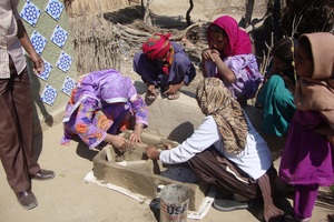 Female staff of AHD completing stove