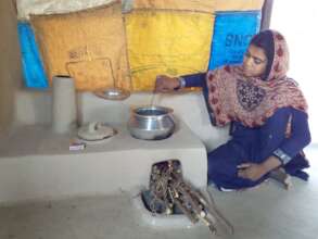 women happy with cooking stove