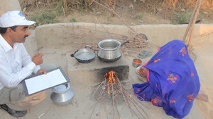 Mrs. Chattan Ram enjoying cooking on new stove