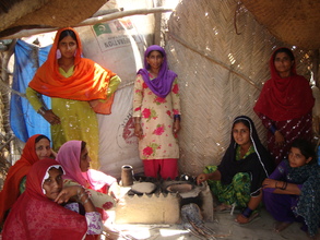 Women using new constructed cooking stove