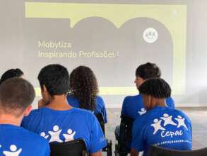 Young people watching the company's presentation.