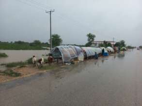 People In Plastic Sheets on Roads - No Tents