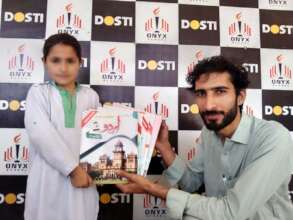 a child receives books from the director 5