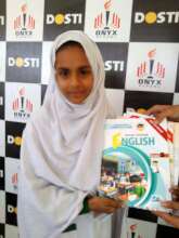 a child receives books from the director 3