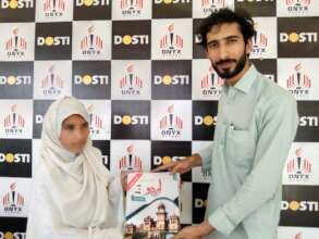 a child receives books from the director 4