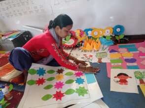 Early ed teacher making English-language decor