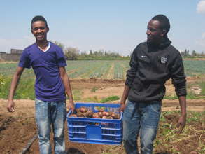 Tadela(on the left) giving back to the community