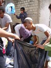 Participants volunteer by preparing aid packages