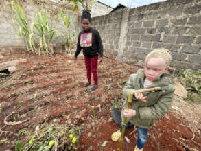 Esther and her daughter Hope in their garden