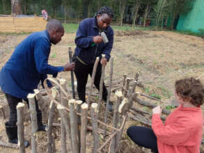 Peace Fellow Julia helps to build a cone garden