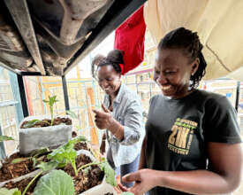 Liz, right, grows vegetables in her balcony