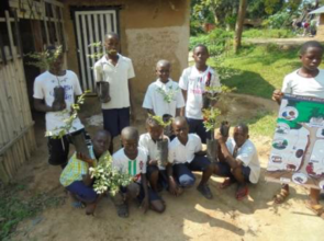 Schoolchildren with trees on Tree Day