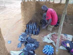 Filling bags with soil to plant tree seeds