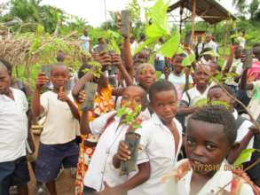 Students receiving seedlings to plant at school