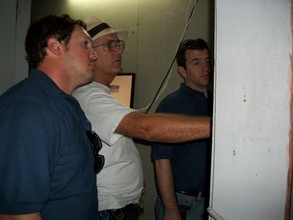 Engineers and Vernon Wilson study breaker box