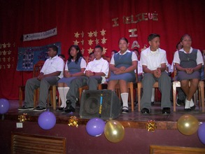Students on stage for graduation