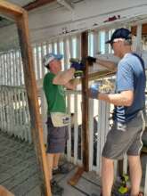 Volunteers working hard on school maintence