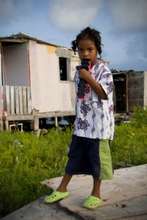 Boy in front of house