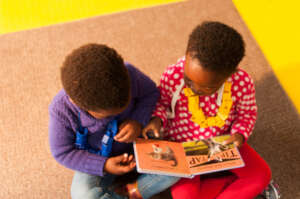 Children enjoying some of the books in our library