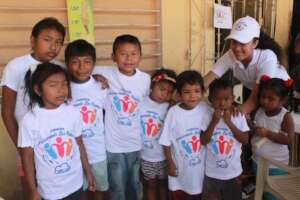Foundation kids and a volunteer