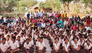 Students, visitors & staff at school amphitheater
