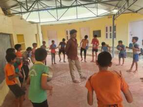 School children learn folk dance