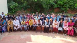 Students pose with visitors and friends