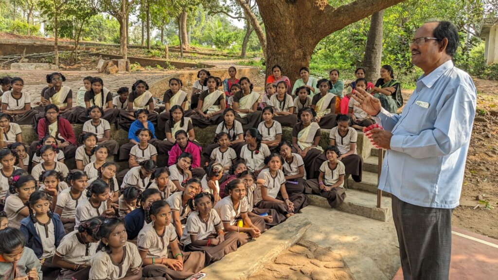 School Principal Sri Murali addresses students