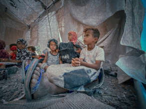 Some of the kids study in a tent