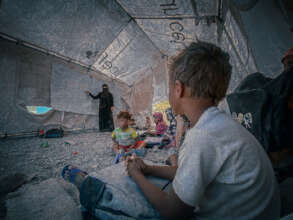 Some of the kids study in a tent