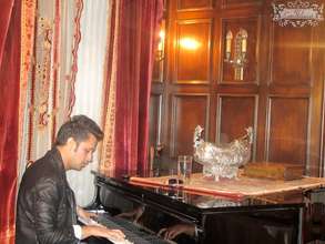 Atif playing the piano