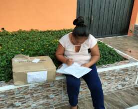 Teacher receiving set of materials