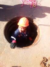 Electrician in a woman-hole