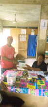 Giving HIV Testing Kit to a Rural Health Center