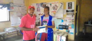 Giving HIV Testing Kit to a Rural Health Center