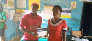 Giving HIV Testing Kit to a Rural Health Center