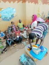 A food seller dishing out food for the children