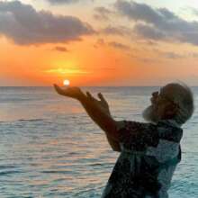 Austin holding the sun by the sea he loves