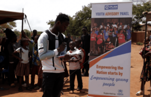 Damien speaking at the Dzaleka refugee settlement