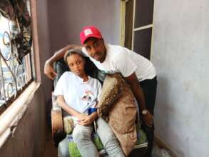 Our Project Leader with the disabled girl